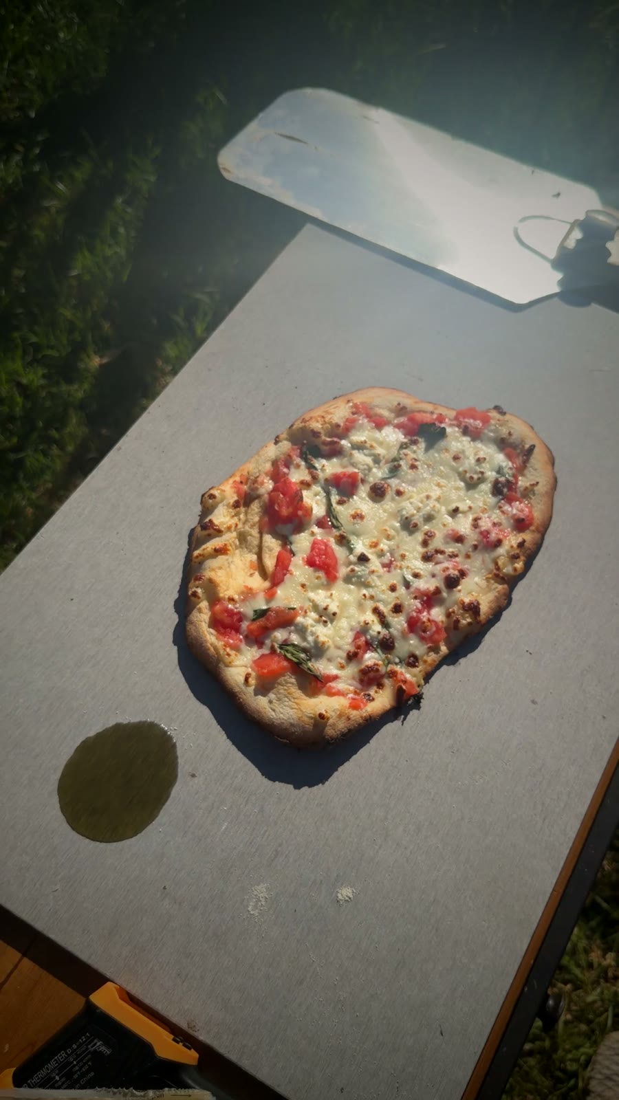 A finished wood-fired pizza with blistered crust